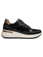 Black sneaker with white sole on a white background