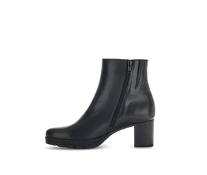 
                  
                    Black ankle boot with a block heel and side zip
                  
                